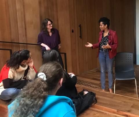 Resa teaching a small in-room workshop